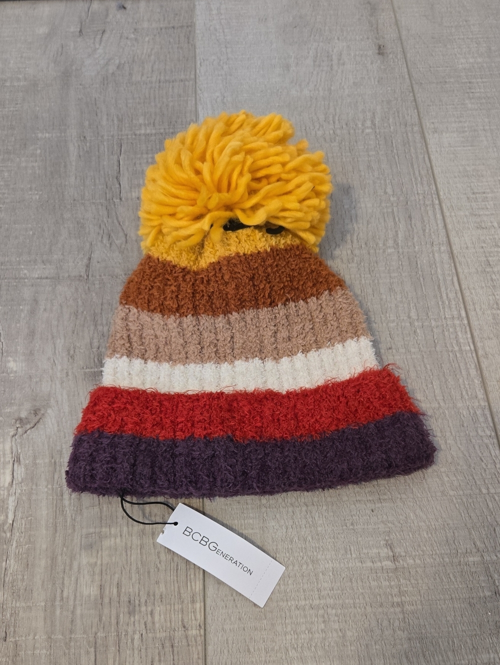 BCBGeneration Pom Beanie in Yellow, Brown, Tan, White, Red, Purple